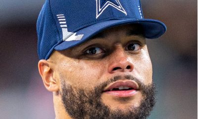 Dallas Cowboys star Dak Prescott looks on during a game.