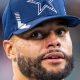 Dallas Cowboys star Dak Prescott looks on during a game.