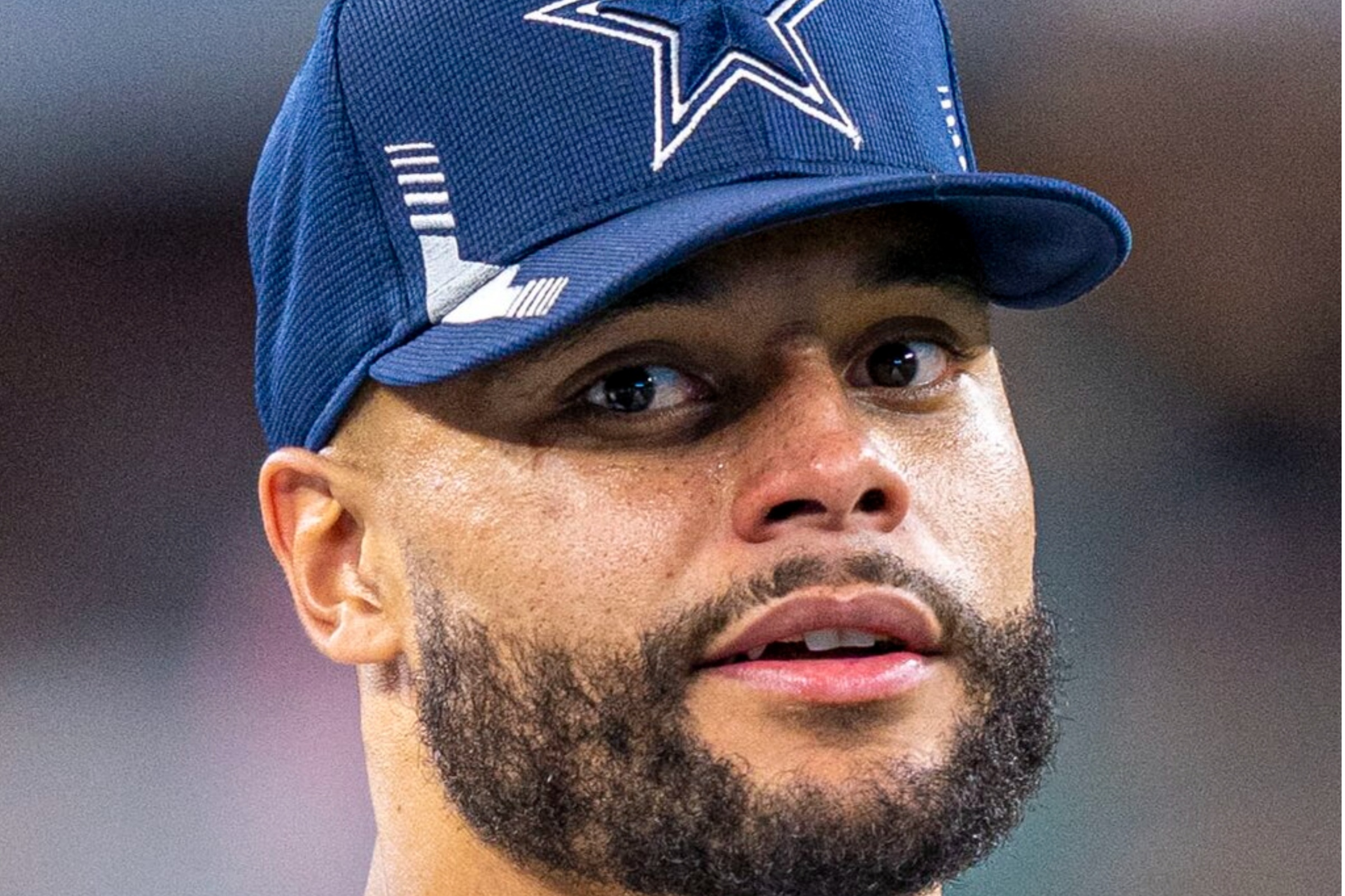 Dallas Cowboys star Dak Prescott looks on during a game.
