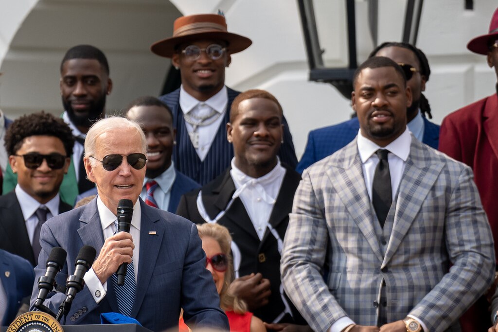 Kansas City Chiefs defensive star Chris Jones looks on with former US President Joe Biden.