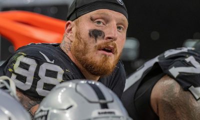 Las Vegas Raiders star Maxx Crosby looks on from the sideline.