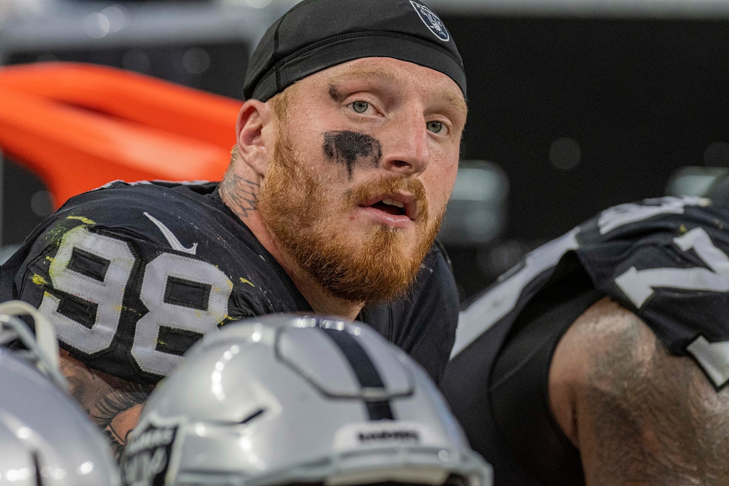 Las Vegas Raiders star Maxx Crosby looks on from the sideline.