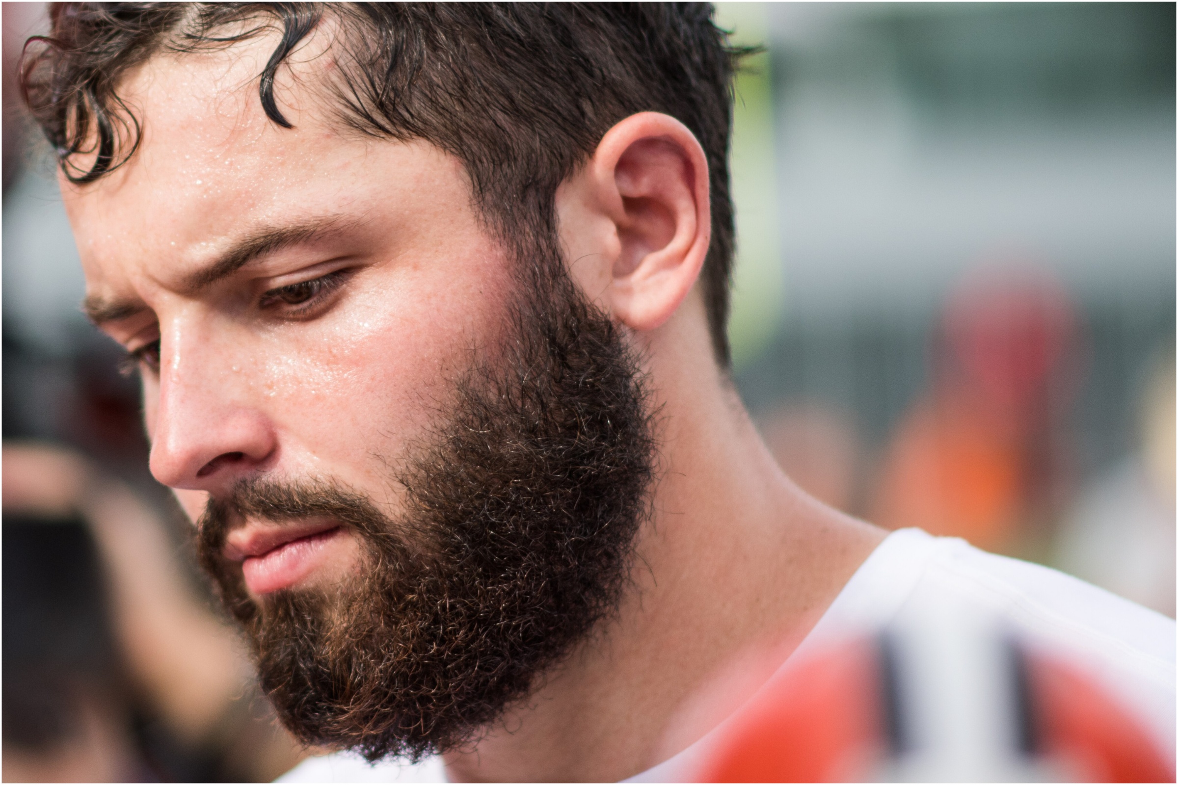 Tampa Bay Buccaneers QB Baker Mayfield looks down.