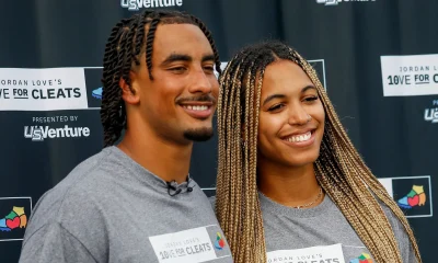 Green Bay Packers quarterback Jordan Love and his fiancée, Ronika Stone, pose for a photo during a charity event with Love’s foundation, Hands of 10ve. | Tork Mason / USA TODAY NETWORK